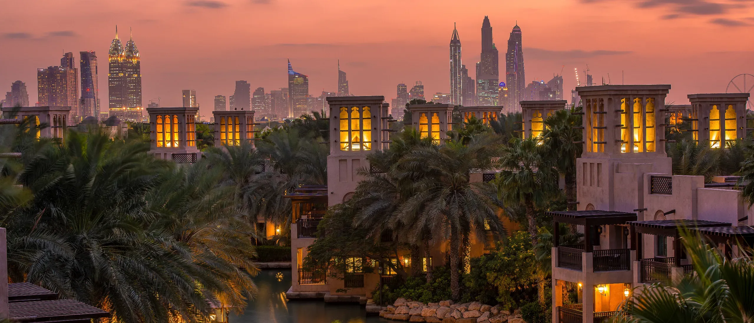 Beautiful sunset overlooking the canal villas and skyscrapers of Dubai